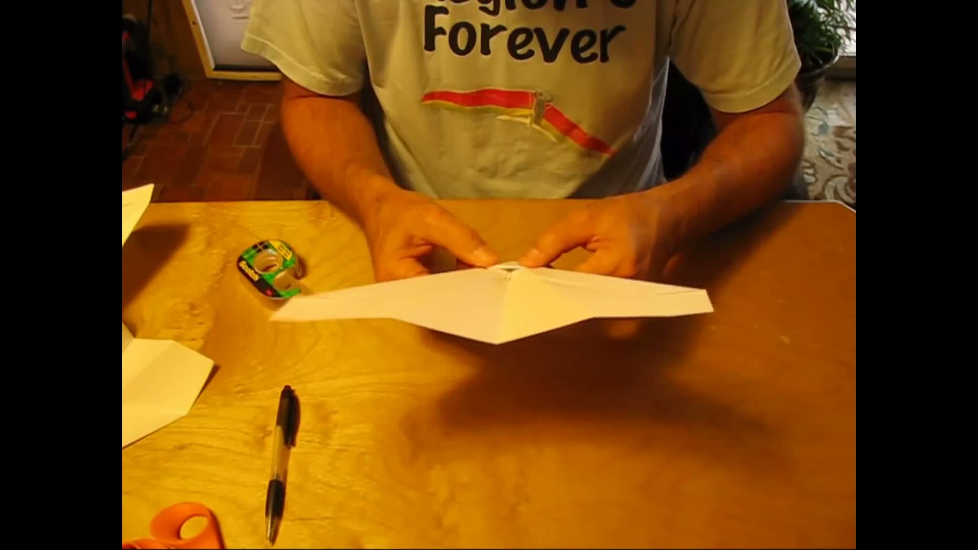 Mike at his table with a sheet of paper, starting the Proto OmniWing